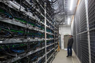 Inside view of a modern mining farm with rows of ASIC miners.